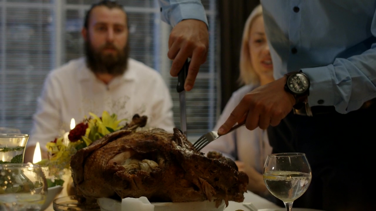 Man cutting the turkey on thanksgiving dinner #food #holiday #celebration #dinner #turkey #thanks giving